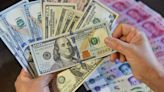 Dollar jumps on central bank divergence, euro hits five-month low