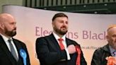 New Labour Party MP for Blackpool South, Chris Webb (C), reacts as his win is announced