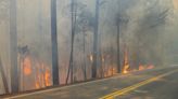 Crews battle wildfires across the US West and fight to hold containment lines