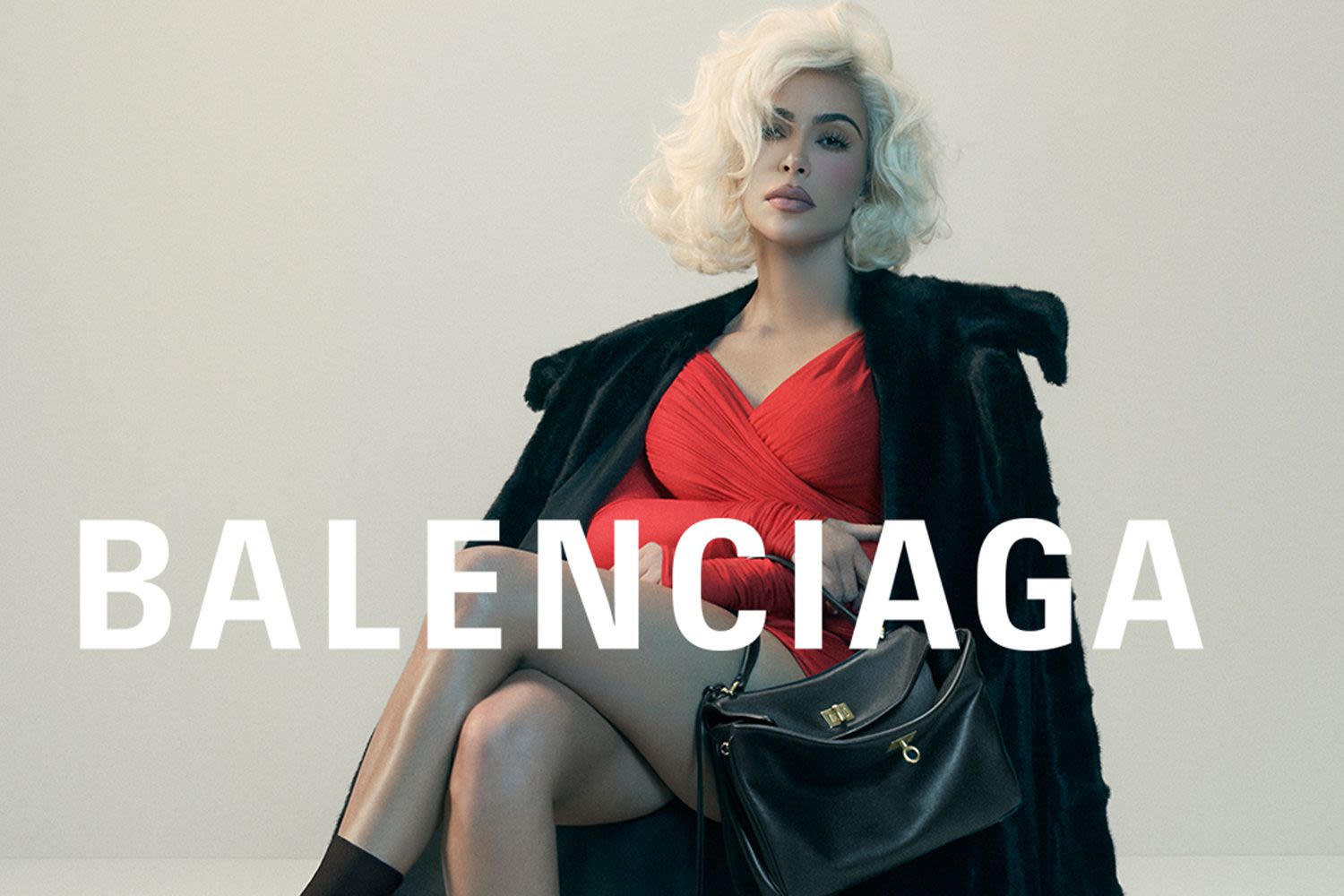 Kim Kardashian Serves Blonde Ambition with Platinum Curls and Carries a $5K Bag in Balenciaga's New Campaign