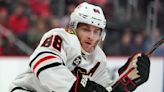 Patrick Kane is signing with the Detroit Red Wings, an AP source says