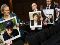 Family members of those who died aboard Ethiopian Airlines Flight 302 arrive with pictures of their loved ones during a U.S. Senate Commerce Committee hearing