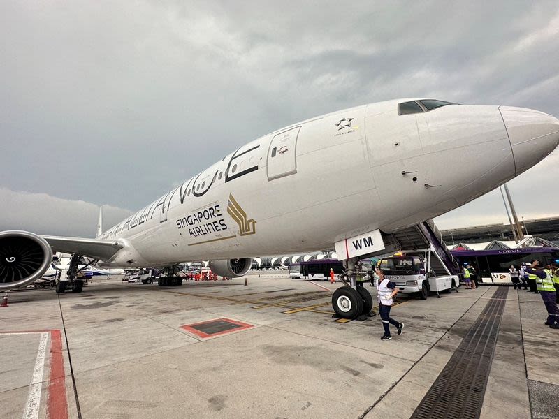 Shaken passengers arrive in Singapore after turbulence-hit flight