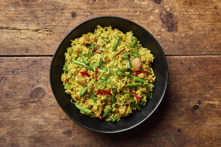 Leftover rice gets a new life in this Nigerian-inspired curried skillet meal