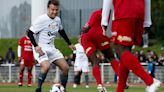 Macron takes part in charity soccer game, showing off sporting prowess