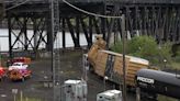 A train derailment shuts down a historic bridge that carries cars and trains in Portland, Oregon