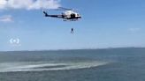 NYPD helicopter seen attempting water operation over Coney Island