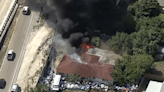 Crews battle large fire at Hollywood home surrounded by storage bins