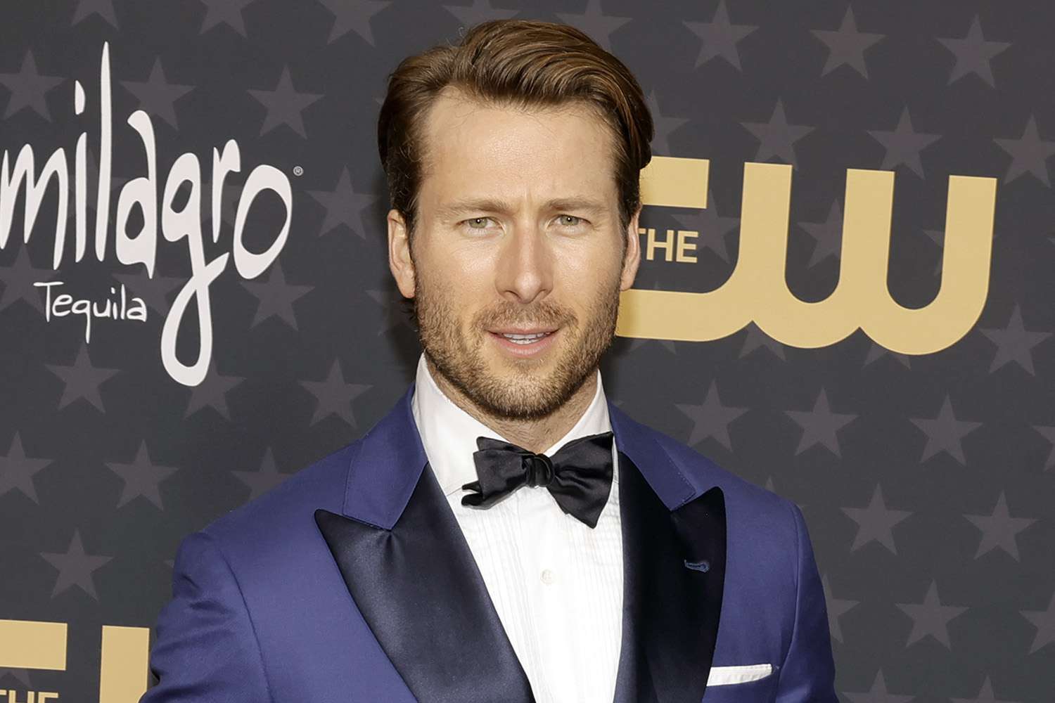 Glen Powell Says He's 'Not Chasing Love' Right Now but Would Welcome It with 'Open Arms'