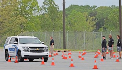 See the video: Lenoir-Rhyne football players tackle traffic stops, physical training with Hickory police