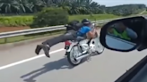 Video of Malaysian teen performing motorbike stunts and crashing while trying to flee highway patrol officers goes viral (VIDEO)