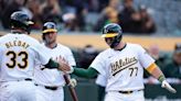 Rooker homers twice in third inning, Athletics roll Marlins 20-4; Arraez has four hits in Padres debut