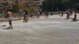 Watch as freak wave smashes beach in Mykonos leaving swimmer with broken ribs