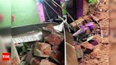 Family narrowly escapes after wall collapses in Puttur | - Times of India