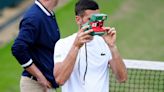 A grinning Novak Djokovic enjoys spending time with his children