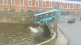 Video: Passenger bus drives over bridge, into river in Russia