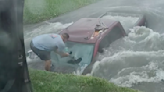 Dramatic video shows Texas couple saving driver from flooded ditch