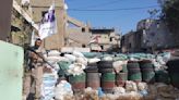 Palestinian security force deploys in school compound in Lebanon refugee camp following clashes