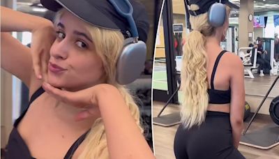 Camila Cabello shows her toned tummy in a black sports bra at the gym