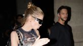 Stella Maxwell leaves her hotel with a mystery man during PFW