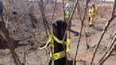 An old car tire, burnt trees and a utility pole may be key in finding how the Maui wildfire spread