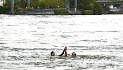 French sports minister Amelie Oudea-Castera dunks herself in the Seine