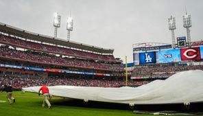 Reds ground crew member gets eaten by tarp during rain delay
