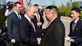 How Putin and Kim’s awkward 40 second handshake compares to Trump and Macron