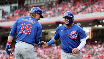 Happ launches 2-run homer and Cubs pound out 17 hits in 13-4 rout of Reds