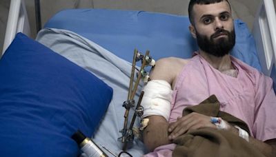 A Palestinian was shot, beaten and tied to an Israeli army jeep. The army says he posed no threat