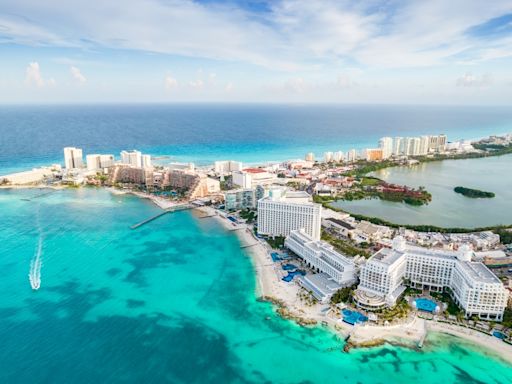 Gunmen on a jet ski open fire at a beach in Cancun, killing a 12-year-old boy