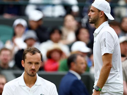 Dimitrov injury sends Medvedev through to Wimbledon quarter-finals