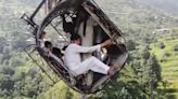 Terrifying drone video shows Pakistan cable car survivors clinging on to dear life during 15-hour ordeal