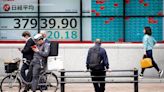 Stock market today: Asian benchmarks mostly slide as investors focus on earnings