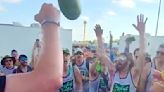 The weirdest tradition at New Orleans Jazz Fest? A watermelon sacrifice with a Saints hero.