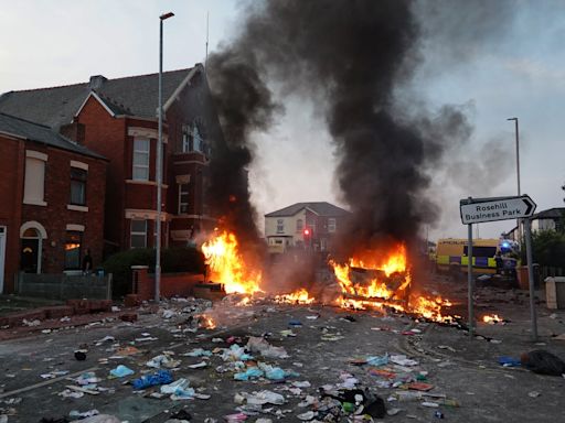 Southport stabbing latest: 39 police officers hurt as van set on fire by suspected EDL supporters