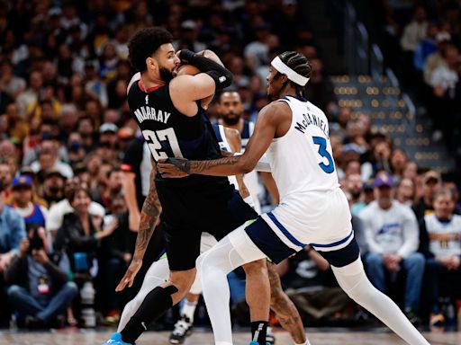 Watch: Jamal Murray throws heat pack onto court and gets away with it