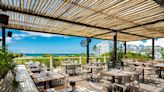 ...This New Celeb-loved Restaurant Overlooks the 'World's Best Beach' — and It Has Local Delicacies, Outdoor Dining, and Stunning Sunset...