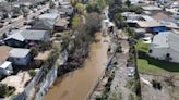 New growth and trash in previously clogged storm channel that led to devastating flooding | City responds