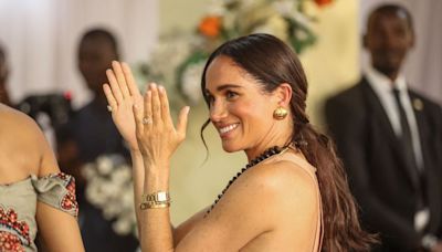 Meghan Nods to the Royals in a Backless Peach Gown Called the “Windsor”