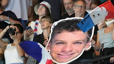 When Léon Marchand swims, nearly all of France watches – even fans at other Olympic events