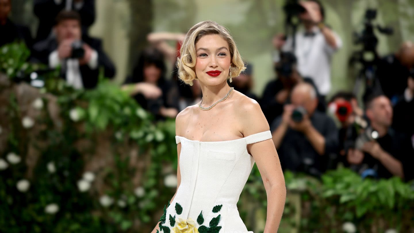 Gigi Hadid Goes Retro in a Floral White Tiered Dress at the 2024 Met Gala