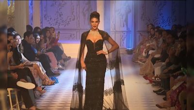 ICW 2024: Jacqueliene Fernandez Dazzled In A Shimmering Black Strapless Gown And Lace Cape On The Rose Room Runway