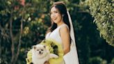 Instead of a traditional bouquet, this bride carried her dog down the aisle