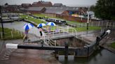 Videos show scale of flash flooding as rain finally hits parched UK, with warnings of more to come