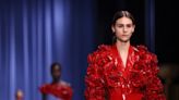 Following theft, Balmain shows defiance with flowers in rose-filled Paris Fashion Week show