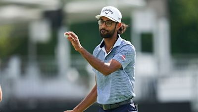 Akshay Bhatia's golf ball falls into a fairway drain, leading to an unusual free drop