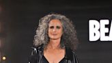 Andie MacDowell makes a bold statement on the runway with black bra, leather trousers, and a crown of grey curls