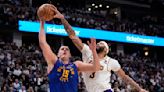 Nikola Jokic leads NBA champ Denver Nuggets past LeBron James and Lakers 114-103 in playoff opener