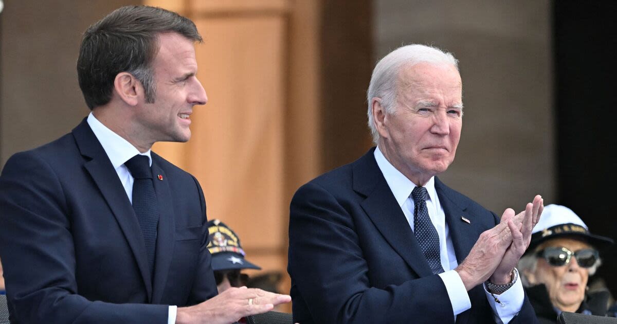 Doddering Joe Biden helped by Emmanuel Macron at D-Day parade